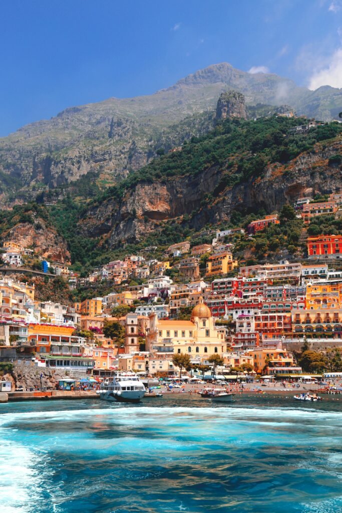 Colorful hillside view of Positano on Italy’s Amalfi Coast with turquoise sea and dramatic cliffs, featured in a 5 days on Amalfi Coast itinerary guide.
