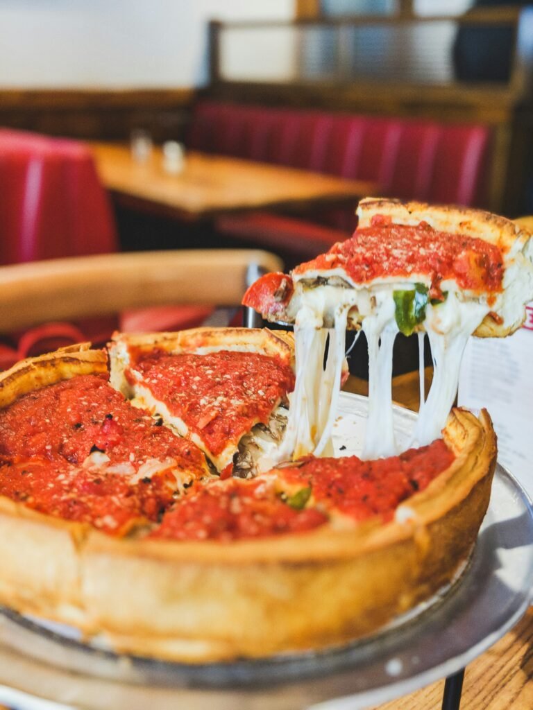 Chicago deep-dish pizza fresh from the oven with layers of cheese and tomato sauce
