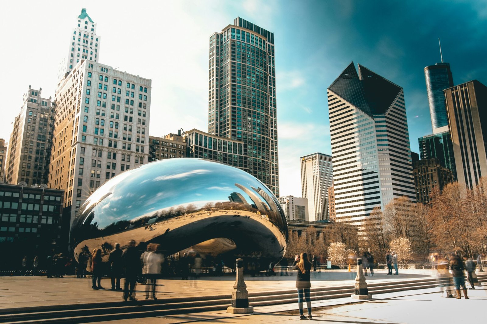 Cloud Gate sculpture in Millennium Park surrounded by Chicago skyscrapers, featured in a 3 day Chicago itinerary guide.