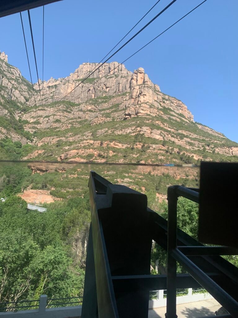 View from the Aeri cable car climbing toward Montserrat