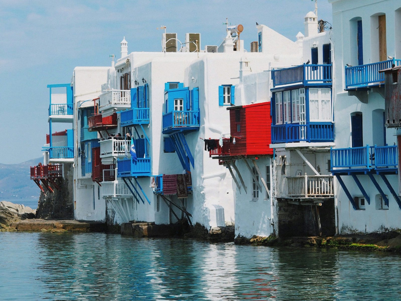 Little Venice waterfront in Mykonos with white buildings beside the sea