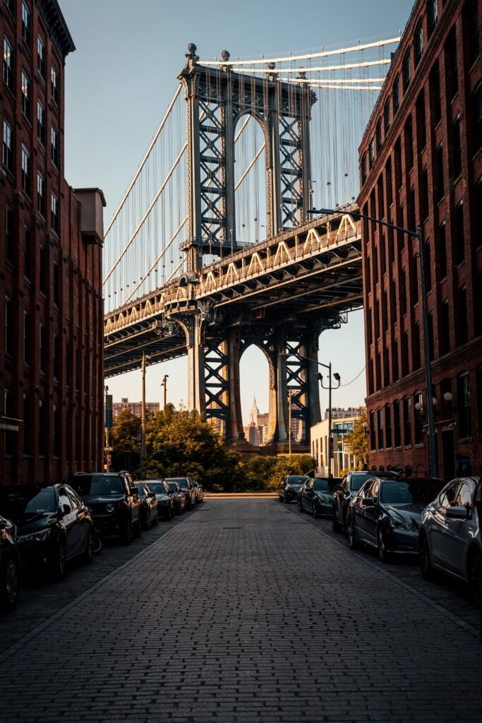 The Manhattan Bridge framed between brick warehouse buildings on Washington Street in DUMBO, Brooklyn