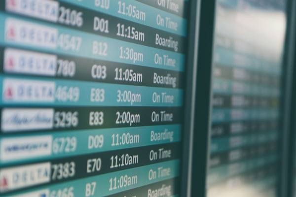 Notebook, passport and travel planning documents for destination guides