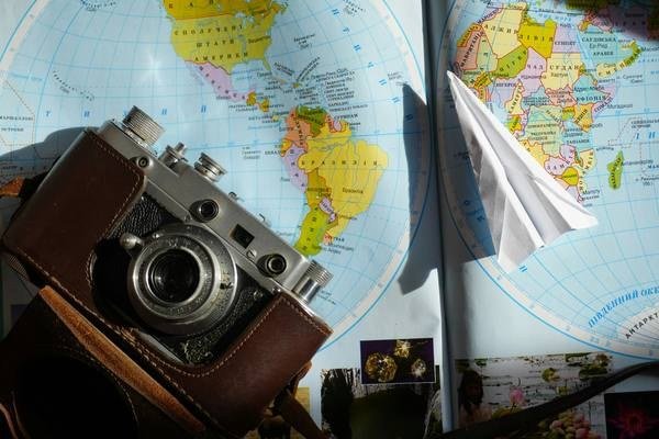 Travel planning board with maps and notes for cost guides