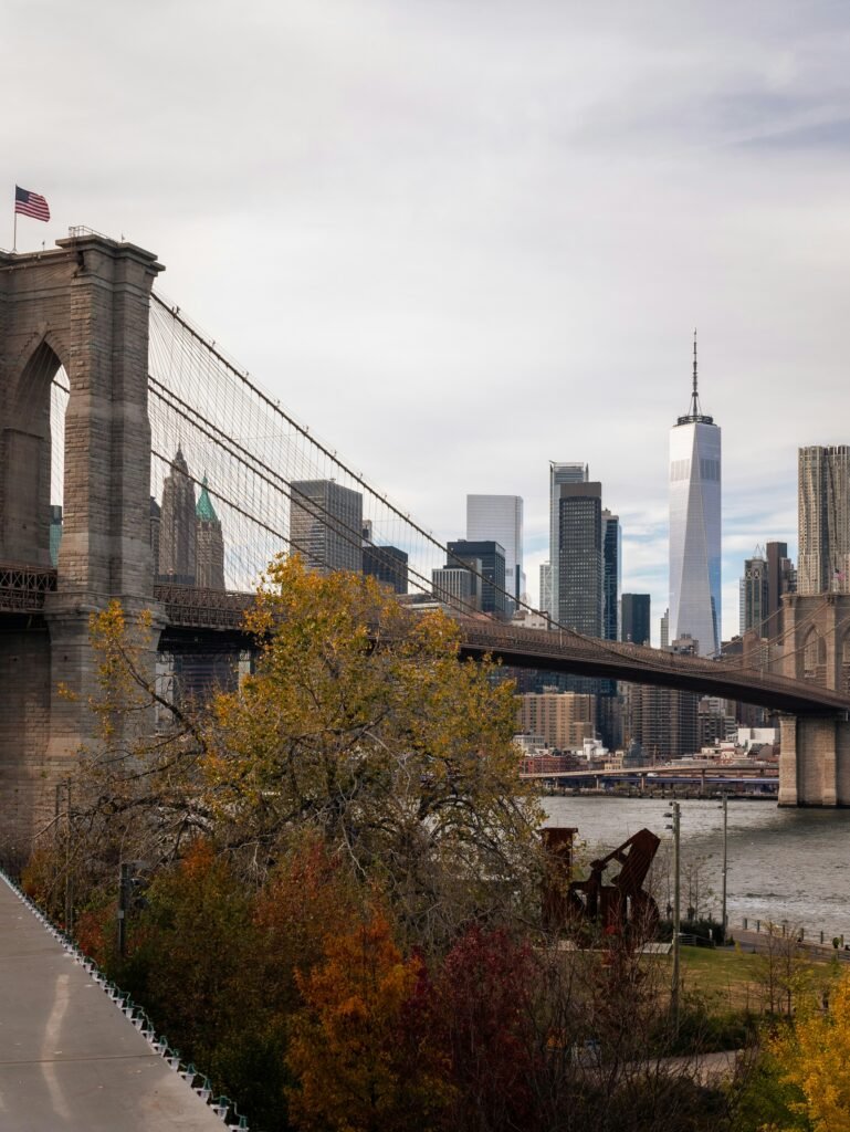 Brooklyn Bridge and Lower Manhattan skyline with fall trees