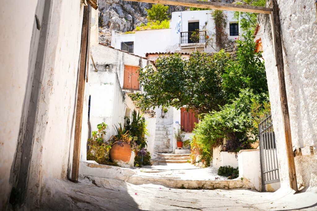 Whitewashed houses with bougainvillea in the Anafiotika neighborhood below the Acropolis in Athens