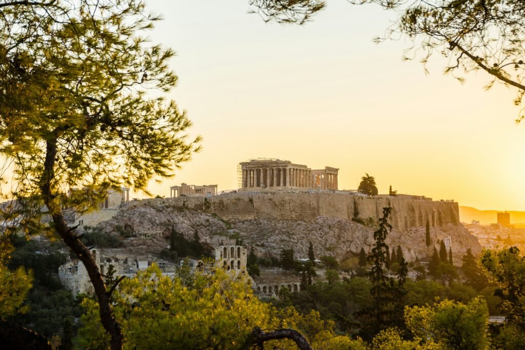 The Acropolis and Parthenon rising above the city of Athens at golden hour