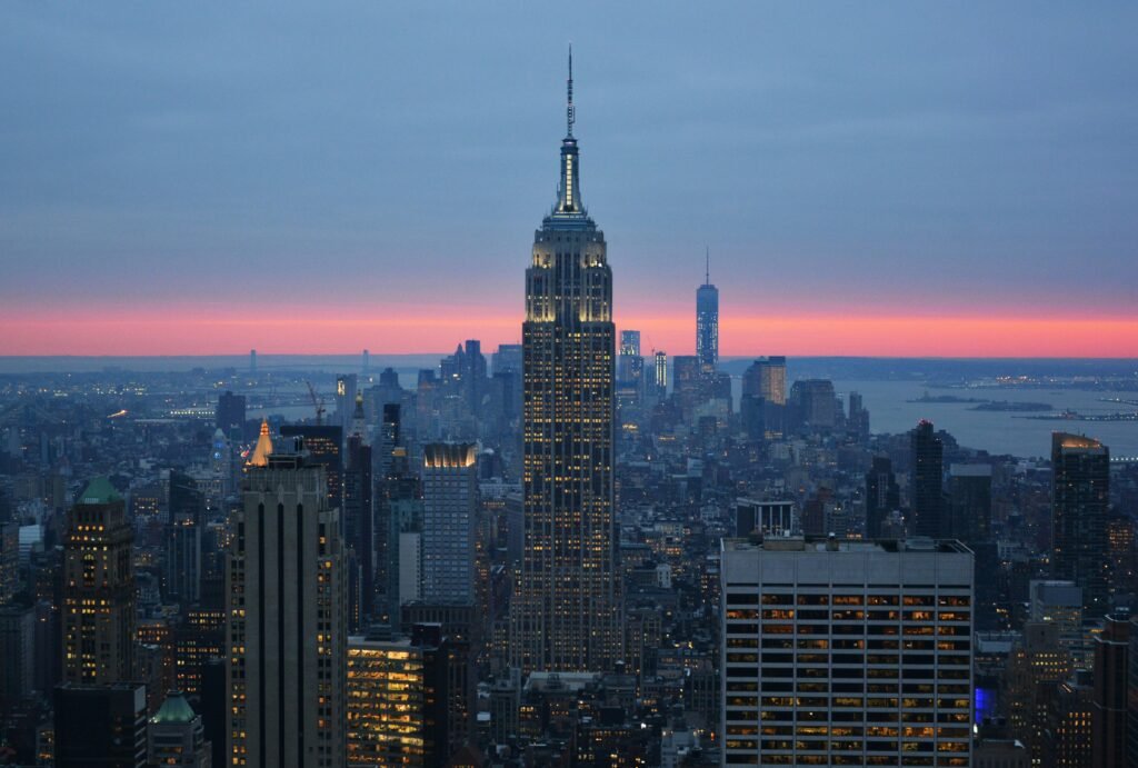 View of the Empire State Building and Manhattan skyline at sunset from the Top of the Rock observation deck