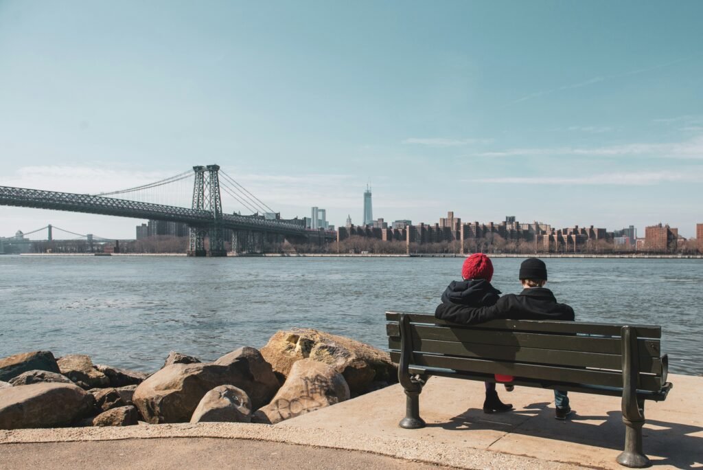 Manhattan skyline at sunset seen across the East River from the Williamsburg waterfront in Brooklyn