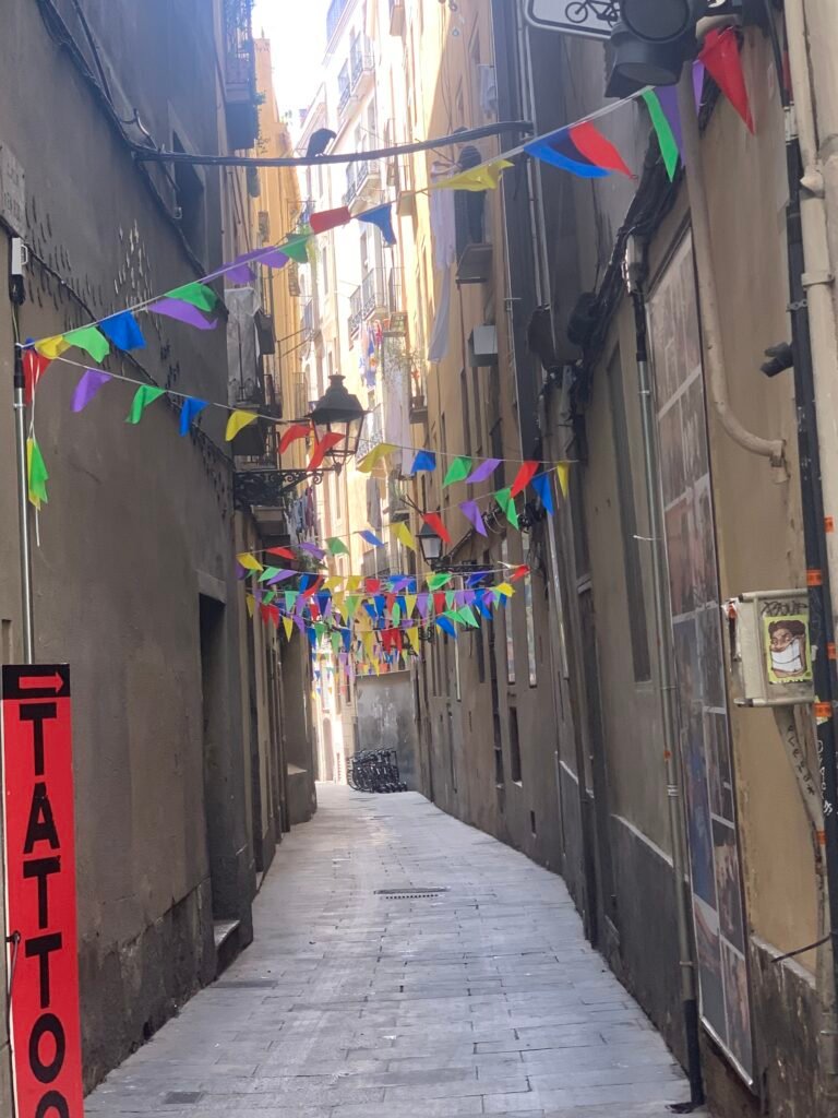 Narrow street in Barcelona's Gothic Quarter with old stone buildings