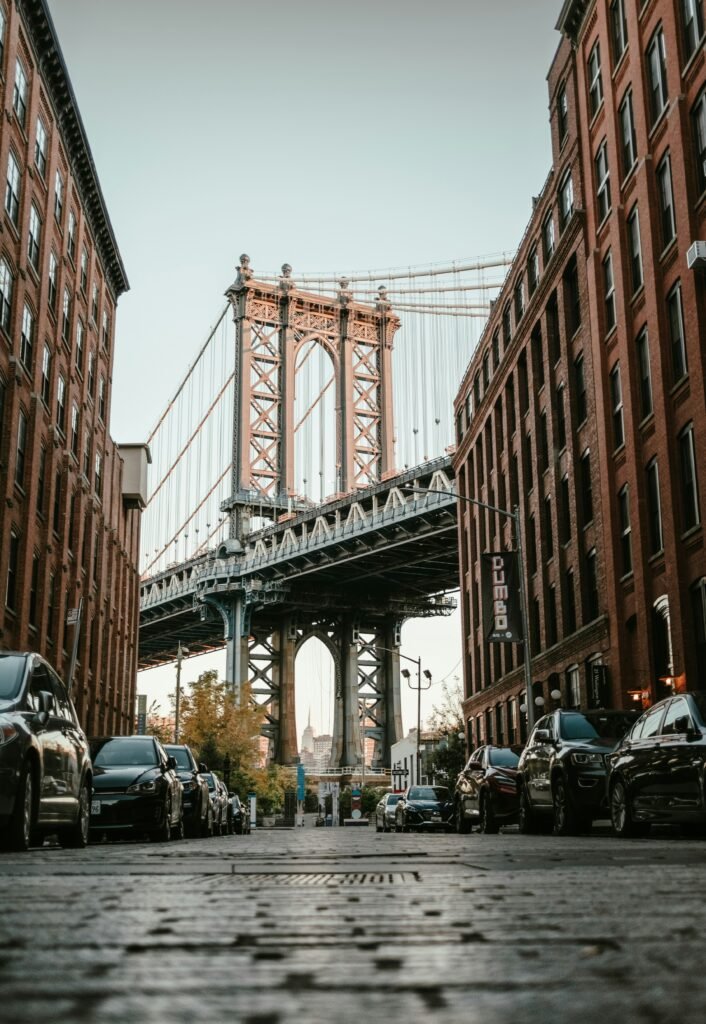 Manhattan Bridge framed by DUMBO brick buildings on Washington Street in Brooklyn