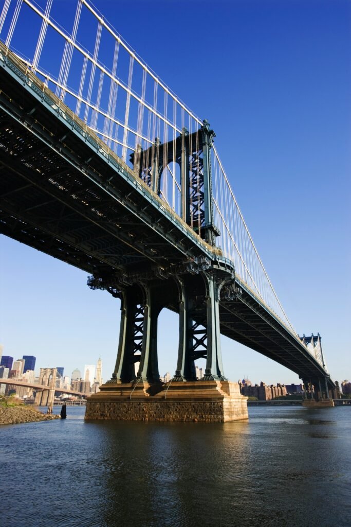 The Manhattan Bridge seen from the Brooklyn waterfront, with the Manhattan skyline in the background
