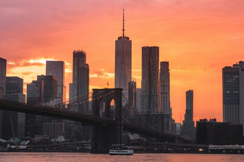 Manhattan skyline seen from Brooklyn Bridge Park at golden hour