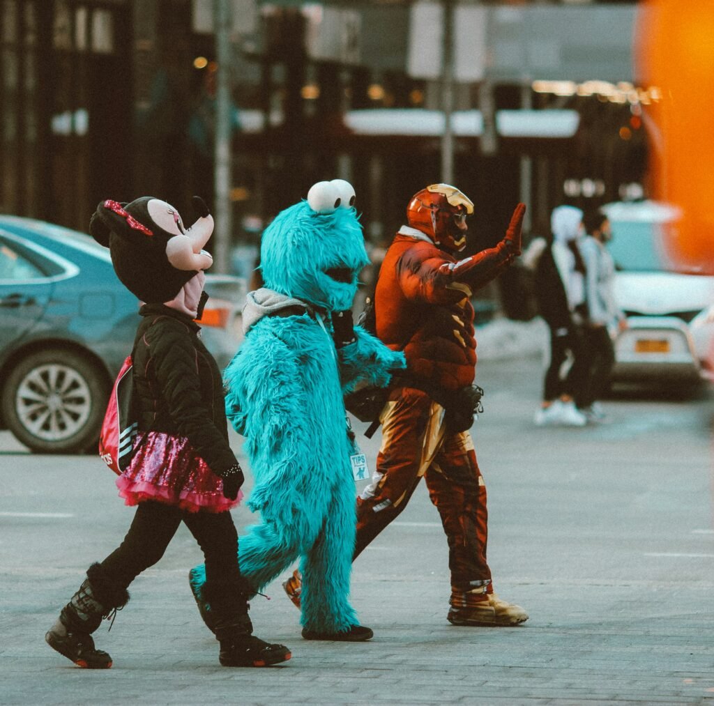 Children in Halloween costumes crossing a New York City street