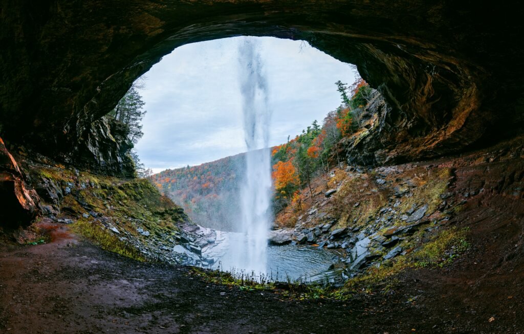 Kaaterskill Falls dropping into a rocky gorge with autumn color in the Catskills