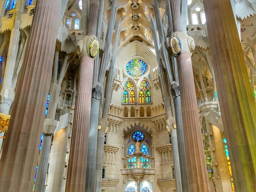 Warm stained glass light inside Sagrada Familia in Barcelona