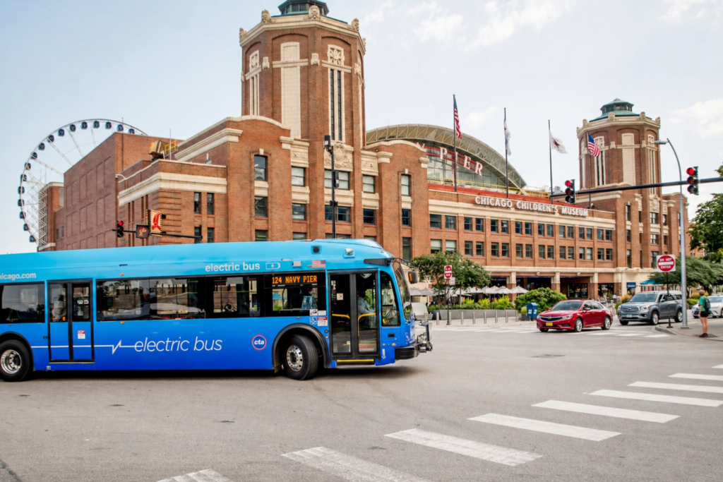 Getting to Navy Pier: CTA bus #124 signed for Navy Pier driving past the entrance on the Chicago lakefront